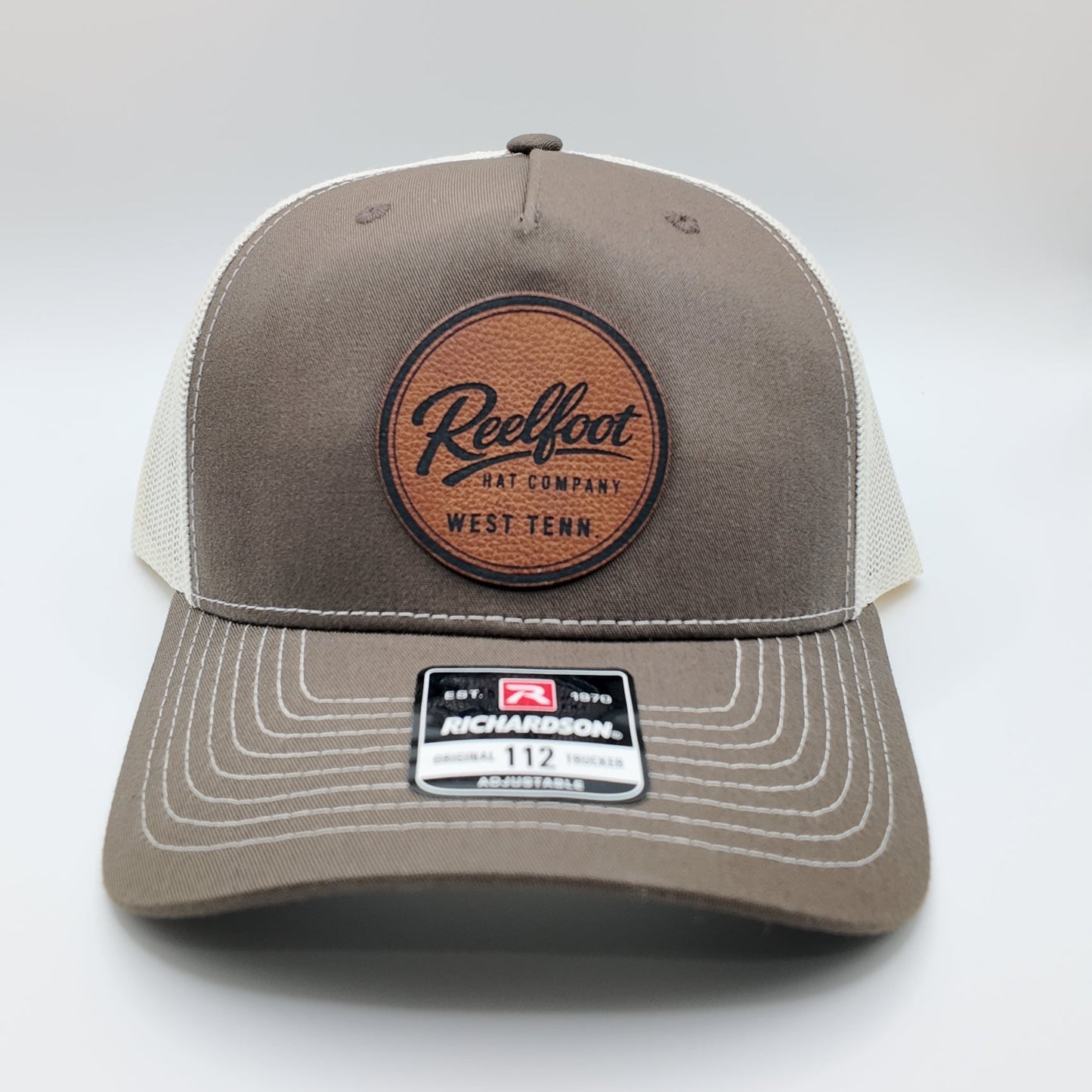 Reelfoot Round Leather Patch 112-Style Trucker Hat