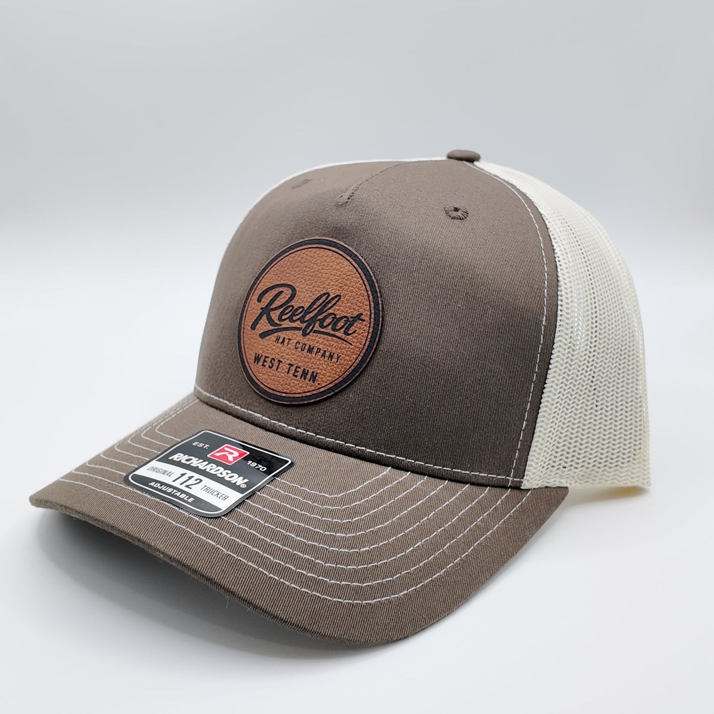 Reelfoot Round Leather Patch 112-Style Trucker Hat