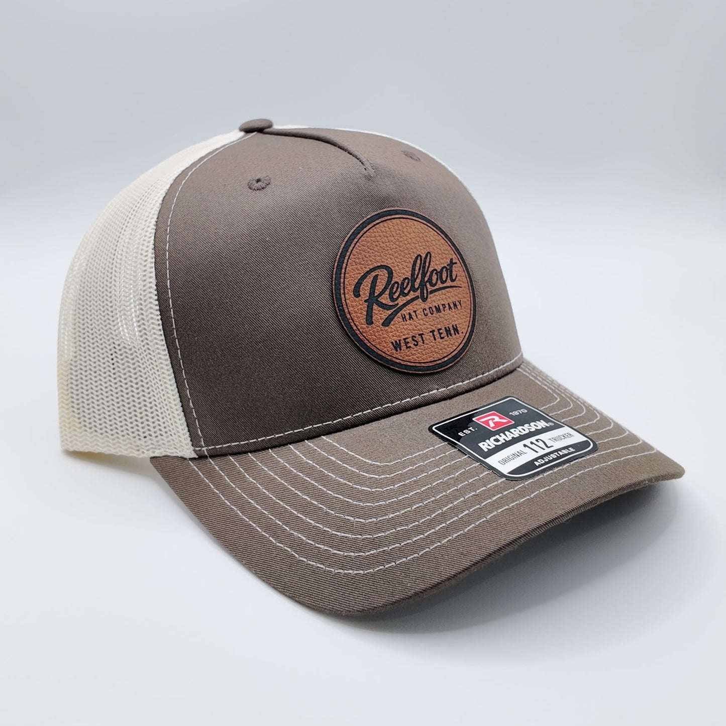 Reelfoot Round Leather Patch 112-Style Trucker Hat