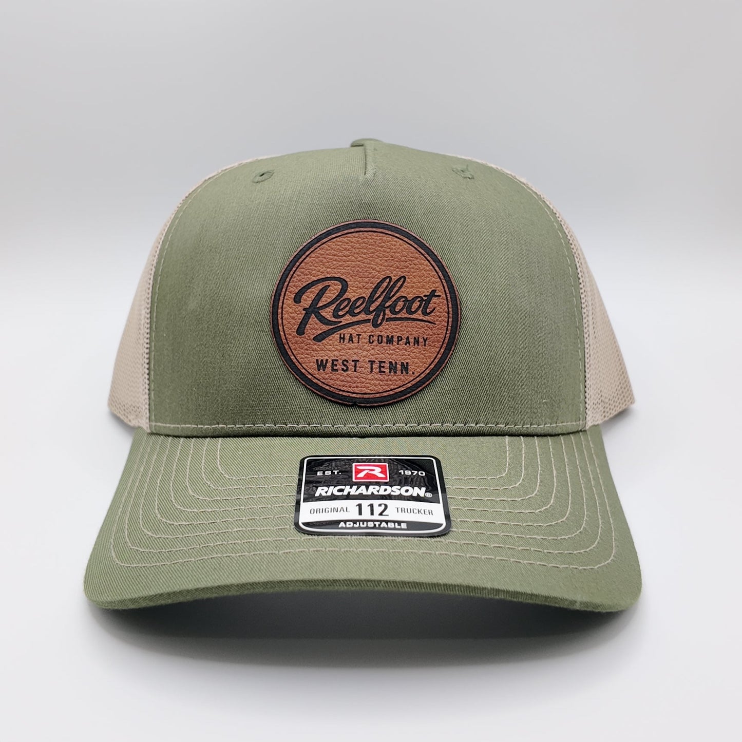 Reelfoot Round Leather Patch 112-Style Trucker Hat