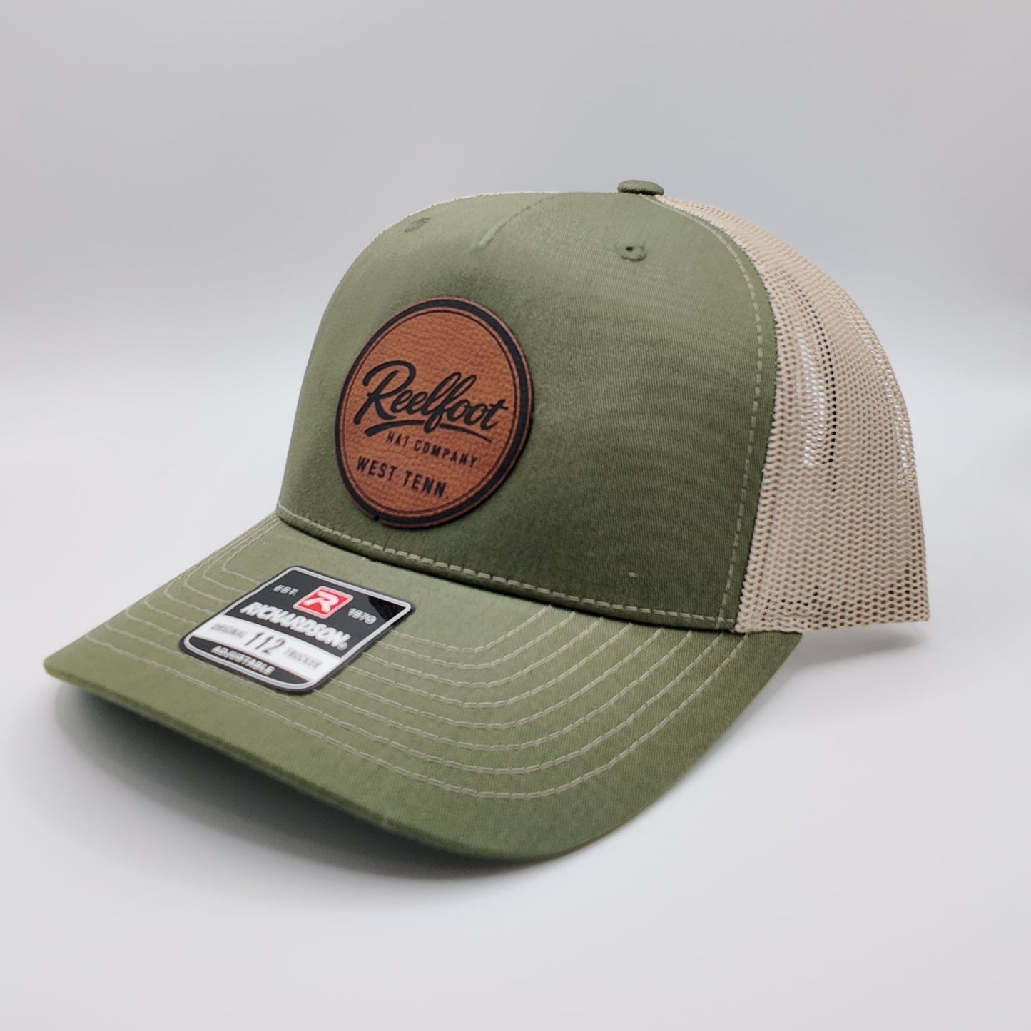 Reelfoot Round Leather Patch 112-Style Trucker Hat