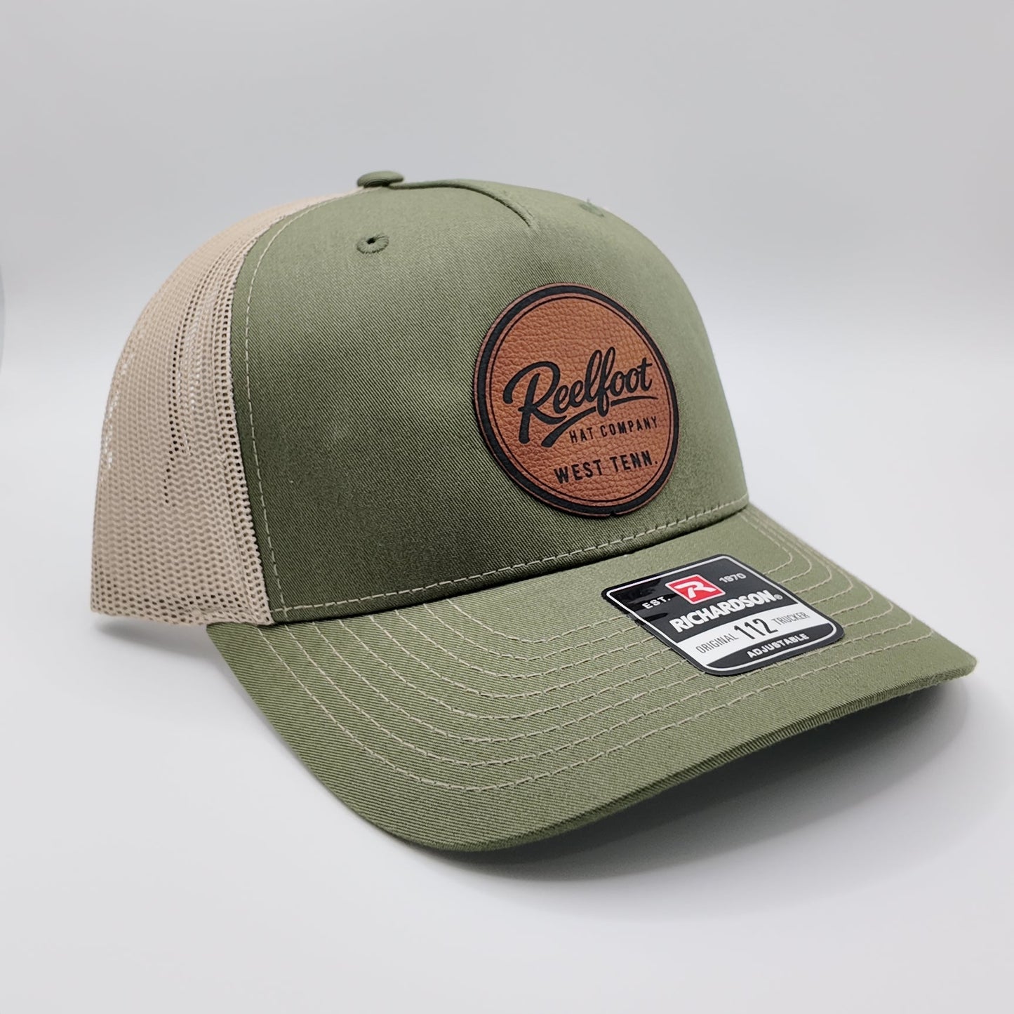 Reelfoot Round Leather Patch 112-Style Trucker Hat
